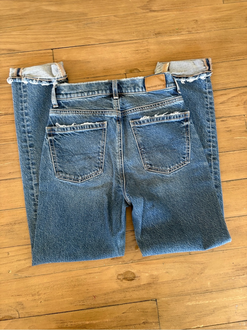 Size 00 American Eagle Classic Blue High-Rise Women’s Jeans with Raw Hem X 2
